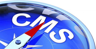 A compass with the arrow pointing to CMS text as a symbol of choosing the right platform
